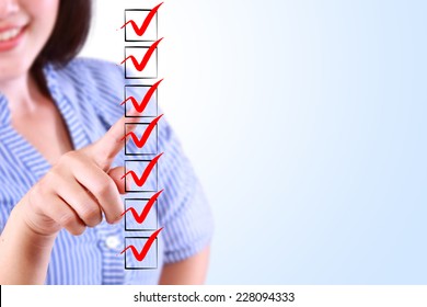 business woman designed on a checklist box - Shutterstock ID 228094333