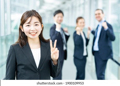 Business woman doing peace sign