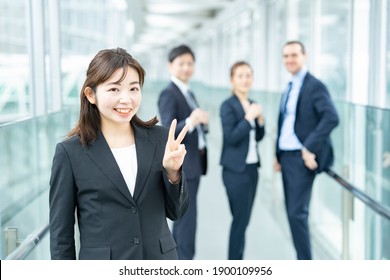Business woman doing peace sign