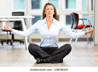 Business Woman Doing Yoga At The Office