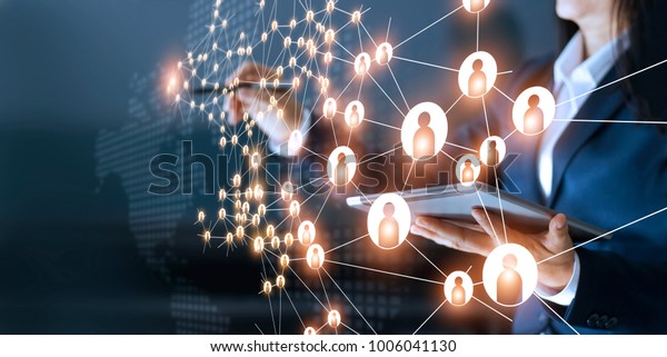 Business woman\
drawing global structure networking and data exchanges customer\
connection on dark\
background