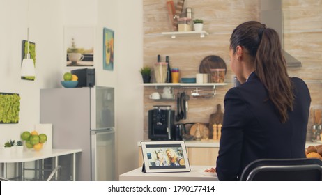 Business Woman During A Video Call With Sister While Eating Breakfast. Using Modern Online Internet Web Technology To Chat Via Webcam Videoconference App With Relatives, Family, Friends And Coworkers