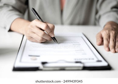 Business woman employer holding resume hiring recruit looking cv resume to hire candidates, analyzing information before job interview. Recruitment concepts. - Powered by Shutterstock