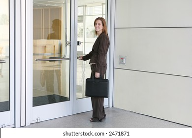 A Business Woman Entering Company To Start Work