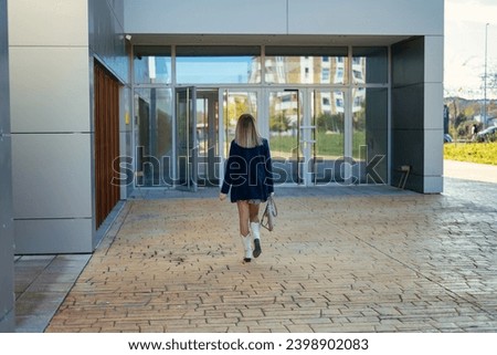 Business Woman Entering Office Building