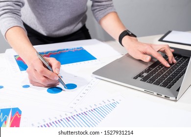 Business Woman Enters Data Into A Computer; Close-up Shot