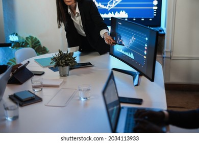 Business Woman Explaining Trading Strategies Inside Bank Meeting Room - Focus On Hand