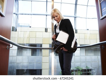 Business Woman In Fancy Elevator