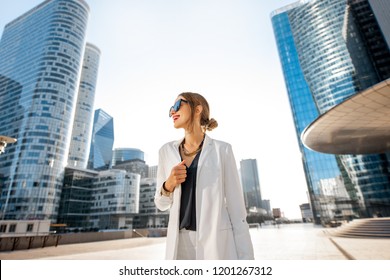 Business woman at the financial district with beautiful skyscrapers on the background during the morning light in Paris - Shutterstock ID 1201267312