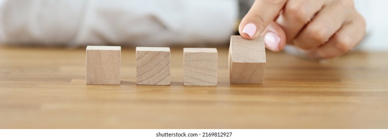 Business Woman Flipping One Wooden Cube From Row