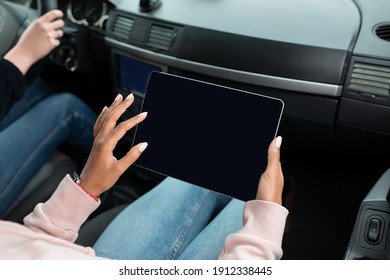 Business Woman, Freelancer Or Blogger In Passenger Seat Or Work. Young Mixed Race Woman Holding Tablet With Blank Screen And Writing Message Or Surfing In Internet In Car, Pov, Free Space, Cropped