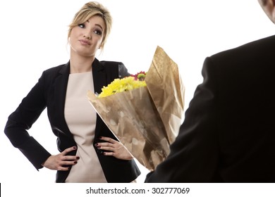 Business Woman Getting Flowers And Not Looking Very Impressed With Her Boyfriend