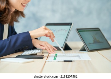 Business woman giving presentation using reference materials