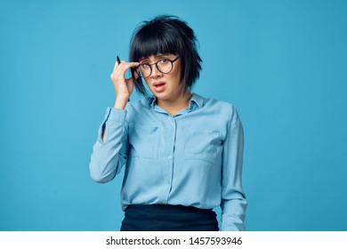     business woman with glasses on a blue background                           