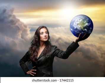 A Business Woman With A Globe