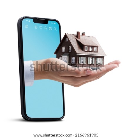 Business woman Hand holding a model house: home insurance and real estate concept On white background