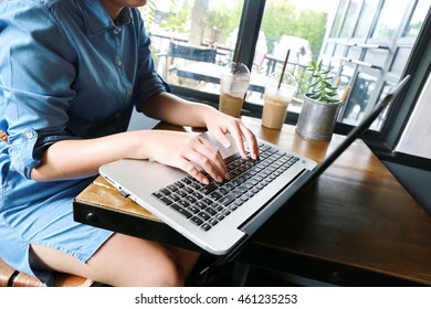 business woman hand multitasking using phone and working on laptop connecting wifi internet and coffee cup, businessman hand busy using laptop at office desk background - Shutterstock ID 461235253
