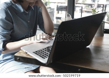 business woman hand multitasking using phone and working on laptop connecting wifi internet and coffee cup, businessman busy hardworking using laptop at office desk background, vintage color