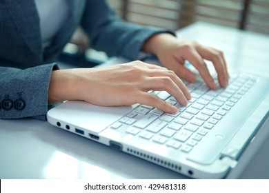 Business Woman Hand Typing On Laptop Keyboard