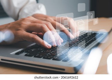 Business woman hand using laptop computer with document management icon, Document management data system business internet technology concept.