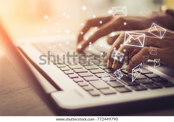 Business woman hand using Laptop pc with email\
icon, Email concept