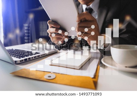 
business woman hand working with laptop computer, tablet and smart phone in office with digital marketing media in icon at  office in morning light 
