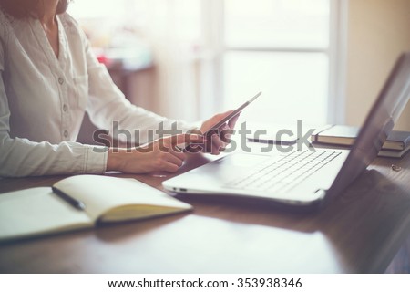 business woman hand working laptop computer on wooden desk