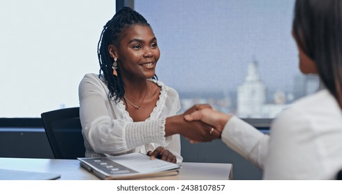 Business, woman and handshake in job interview for welcome to meeting with smile, hr and thank you in office. African employee, client and shaking hands with documents for hiring deal and recruitment - Powered by Shutterstock