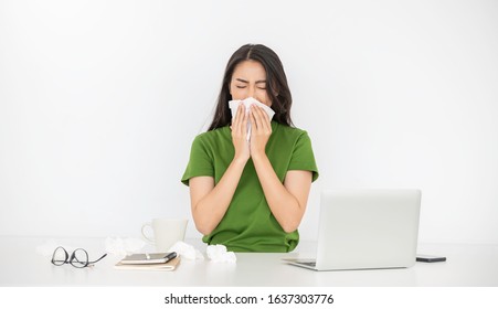 Business Woman Have A Cold Blowing Her Runny Nose With Tissue. Portrait Of Asian Beautiful Girl Get Sick Sneezing From Flu In Her Office. Healthcare Medical Overload Burnout Concept.