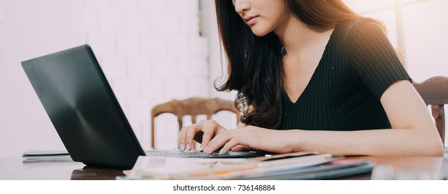 Business woman at have the confidence in a working are being, Check data financial transactions via  the computer.