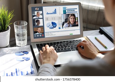 Business woman in headphones talking to her colleagues in video conference. Multiethnic business team working from home using laptop, discussing financial report of their company. - Shutterstock ID 1756378400