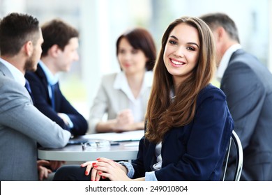 Business Woman With Her Staff, People Group In Background At Modern Bright Office Indoors