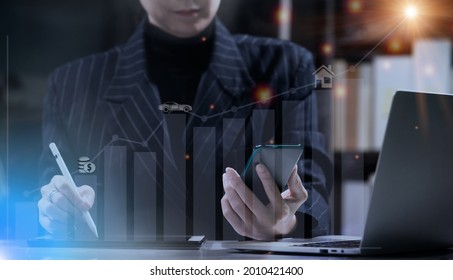 Business Woman Hold Smart Phone And Check Data In Notebook. Housewife Review Bank Savings Account, Investment, Interest, Future Life Reward And Insurance Concept