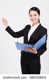 A business woman holding a blue folder high quality photo - Shutterstock ID 1887628054