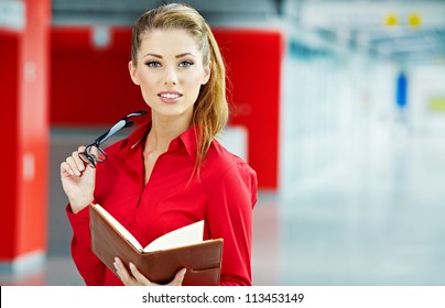 Business Woman Holding Glasses And Looking At Camera. Copy Space