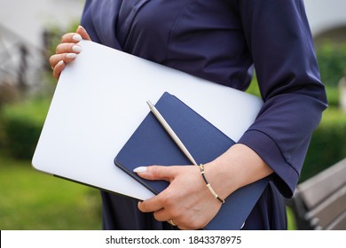 Business Woman Holding A Notebook Notepad And Pen In Her Hands.