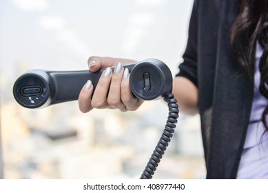 Business Woman Is Holding The IT Phone Handset