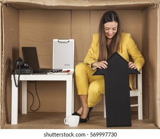 Business Woman Holds The Arrow Up Sign To Bounce Back From The Bottom