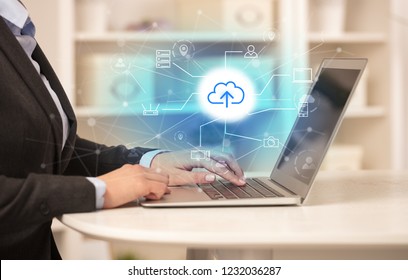 Business woman in homey environment using laptop with  online storage and cloud technology concept - Shutterstock ID 1232036287