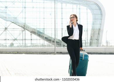 . Business woman at international airport moving to terminal gate for airplane travel trip - Mobility concept and aerospace industry flight connections
