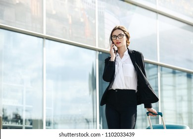 . Business Woman At International Airport Moving To Terminal Gate For Airplane Travel Trip - Mobility Concept And Aerospace Industry Flight Connections