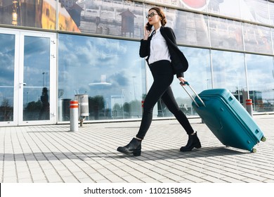 . Business Woman At International Airport Moving To Terminal Gate For Airplane Travel Trip - Mobility Concept And Aerospace Industry Flight Connections