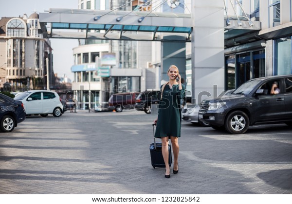 Business woman at international airport moving to\
terminal gate for airplane official trip. Mobility concept and\
aerospace industry flight connections. Busy and confident,\
executive woman,\
manager