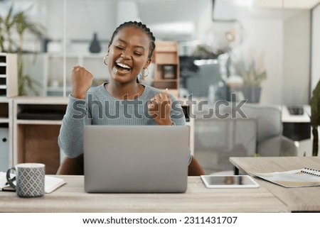 Business woman, laptop and celebration with fist for winning, success or promotion bonus at office. Happy black woman employee in joyful happiness on computer for win, prize or good news at workplace