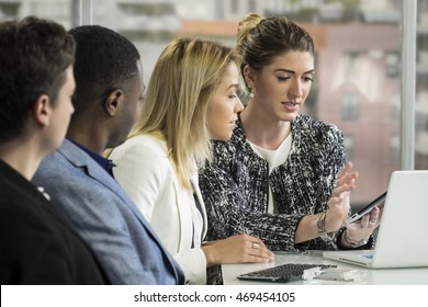 Business Woman Leading A Meeting With Her Tablet/ipad