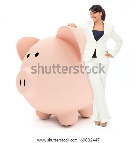 Business woman leaning on a piggybank - isolated over white