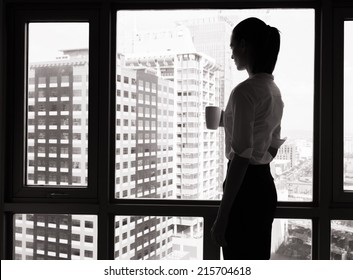 Business woman looking out the window