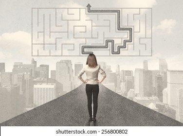 Business woman looking at road with maze and solution concept
