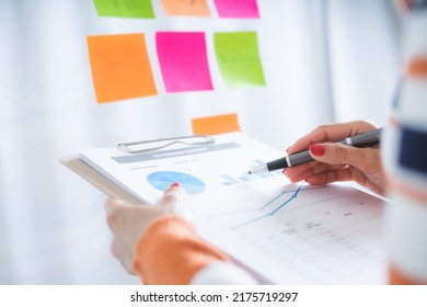 Business woman meeting at office and use post it notes to share idea. Brainstorming concept. Sticky note on glass wall. - Shutterstock ID 2175719297