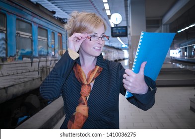 Business Woman In Metro Station Reading Files About Train Time Table.Female Manager At Work In Railway Controling Train Schedule 